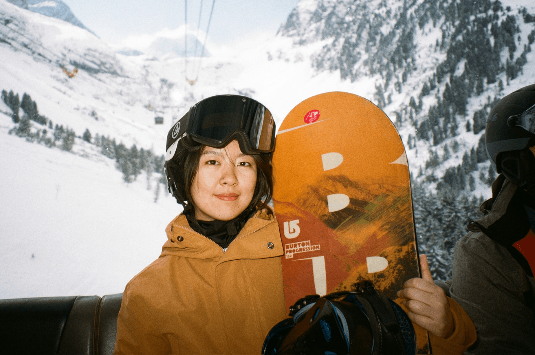 Snowboarding with mountains in the background