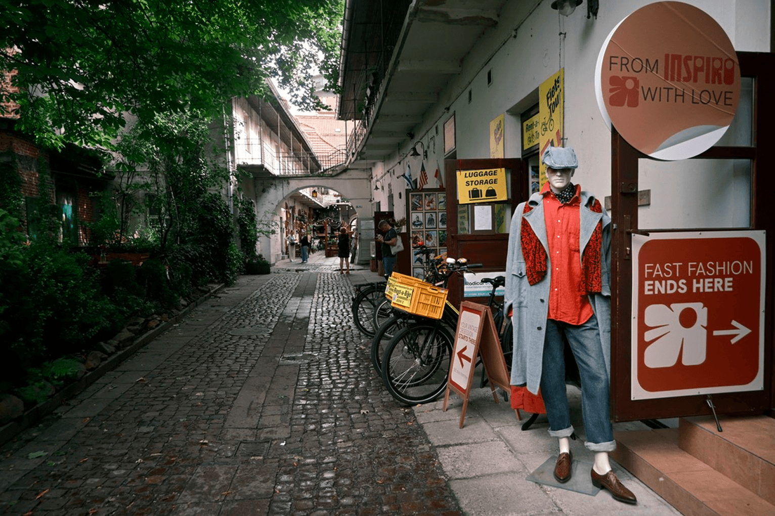 Alleyway with Fast Fashion Ends Here sign