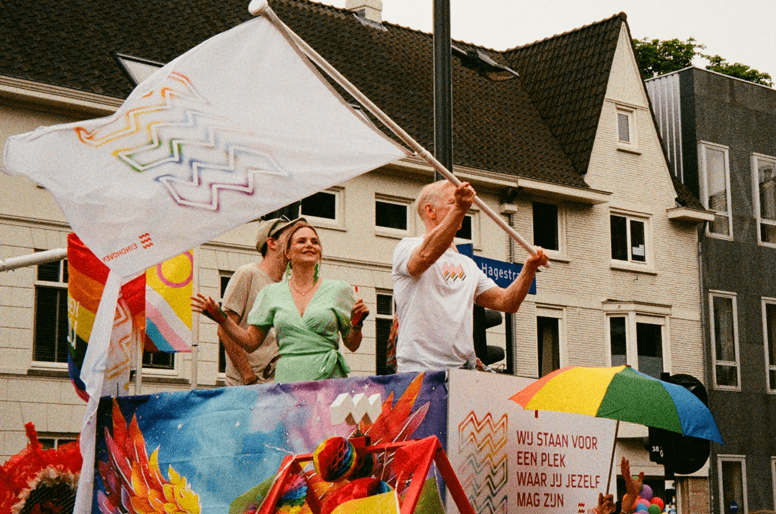 Parade float with rainbow umbrella