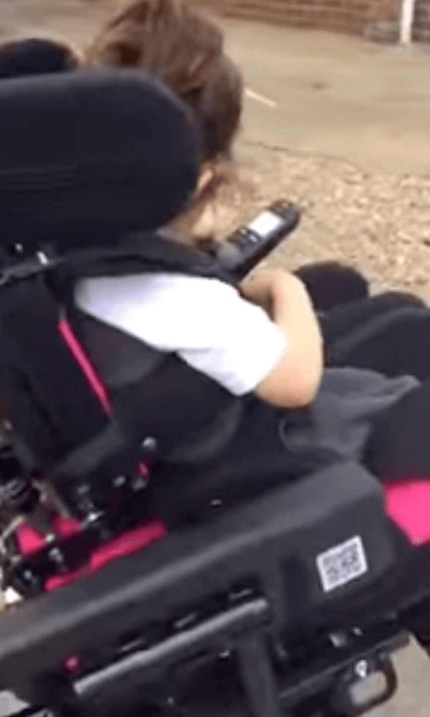 Child in a powered wheelchair